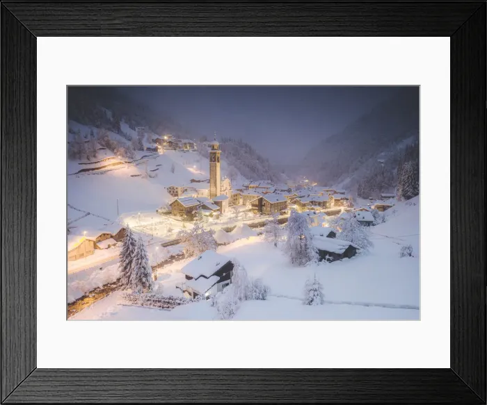 Framed Print : Illuminated village of Gerola Alta and frozen river covered with snow during winter dusk Framed Print : Illuminated village of Gerola Alta and frozen river covered with snow during winter dusk