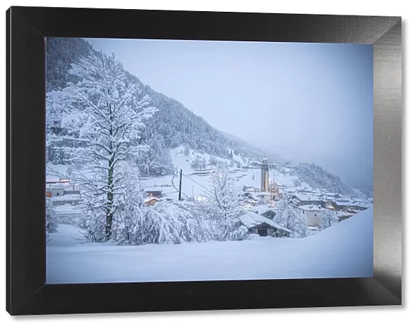 Alpine village in a white winter landscape after snowfall, Gerola Alta, Valgerola