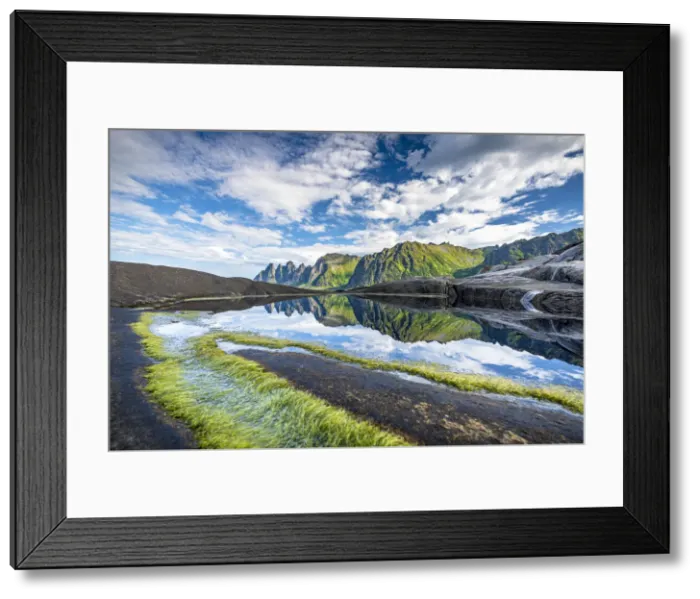Framed Print : Seaweed on cliffs with mountains reflected in water in the background, Tungeneset, Senja Framed Print : Seaweed on cliffs with mountains reflected in water in the background, Tungeneset, Senja