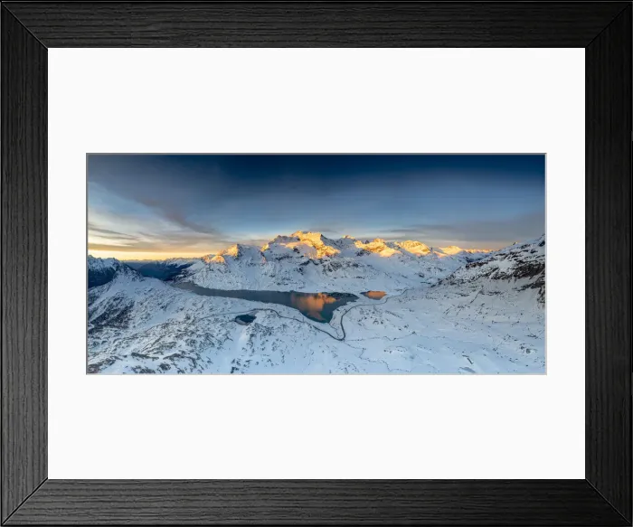 Framed Print : Winding road of Bernina Pass in the winter landscape near the frozen Lago Bianco Framed Print : Winding road of Bernina Pass in the winter landscape near the frozen Lago Bianco