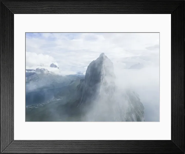 Framed Print : Aerial view of fog over the majestic Segla Mountain peak emerging from clouds Framed Print : Aerial view of fog over the majestic Segla Mountain peak emerging from clouds