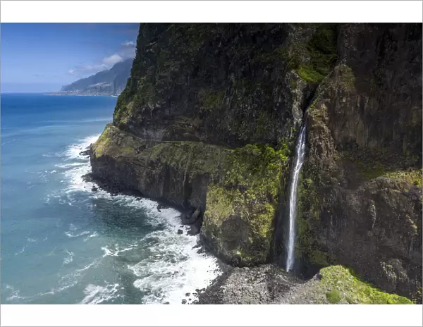 Flowing water of Bridal Veil Fall cascading from rocks, Seixal, Madeira island, Portugal