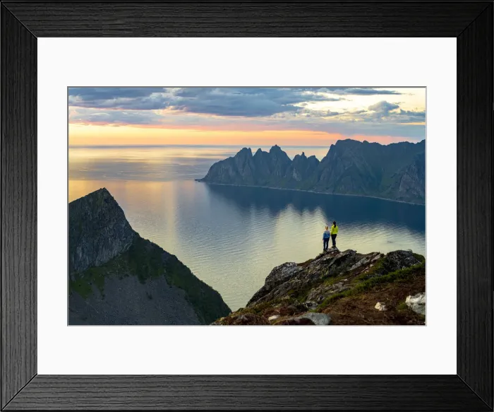 Framed Print : Two young women watching sunset standing on mountain top, Senja island, Troms county Framed Print : Two young women watching sunset standing on mountain top, Senja island, Troms county