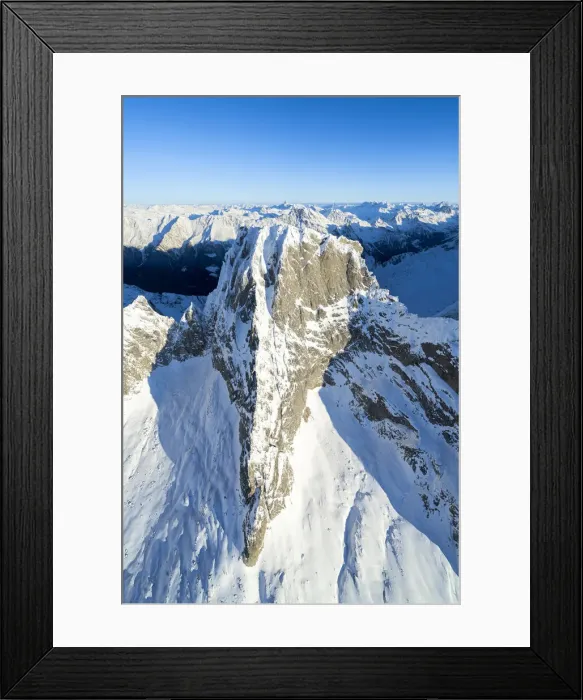 Framed Print : Clear winter sky over majestic Pizzo Badile covered with snow, Val Masino, Valtellina Framed Print : Clear winter sky over majestic Pizzo Badile covered with snow, Val Masino, Valtellina