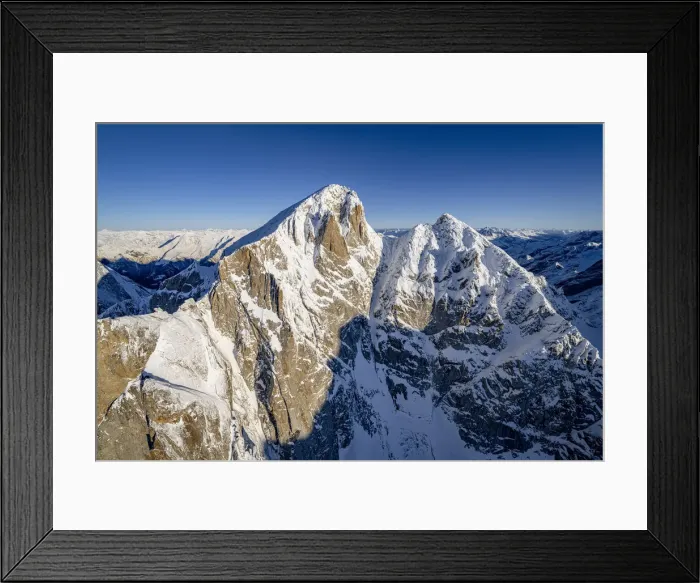 Framed Print : Clear sky over majestic Pizzo Cengalo in winter, aerial view, Val Masino, Valtellina Framed Print : Clear sky over majestic Pizzo Cengalo in winter, aerial view, Val Masino, Valtellina