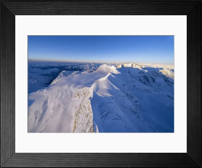 Framed Print : Aerial view of snowy peaks Piz Palu, Piz Zupo and Piz Bernina lit by sunrise, Engadine Framed Print : Aerial view of snowy peaks Piz Palu, Piz Zupo and Piz Bernina lit by sunrise, Engadine