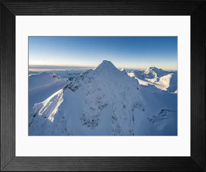 Framed Print : Snowcapped rock face of Monte Disgrazia and Piz Gluschaint in winter, aerial view Framed Print : Snowcapped rock face of Monte Disgrazia and Piz Gluschaint in winter, aerial view