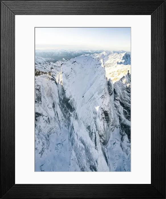 Framed Print : Pizzo Badile covered with snow after a winter blizzard, aerial view, Val Bregaglia Framed Print : Pizzo Badile covered with snow after a winter blizzard, aerial view, Val Bregaglia