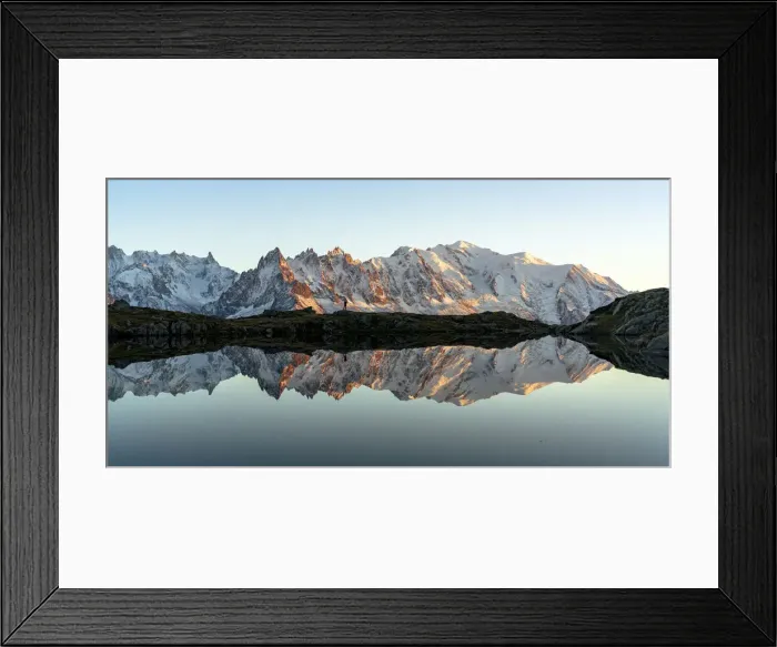 Framed Print : Hiker admiring Dent du Geant and Mont Blanc covered with snow reflected in Lacs des Framed Print : Hiker admiring Dent du Geant and Mont Blanc covered with snow reflected in Lacs des
