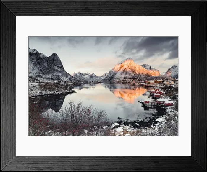 Framed Print : Clouds at dawn over traditional Rorbu and Olstind mountain reflected in sea, Reine Bay