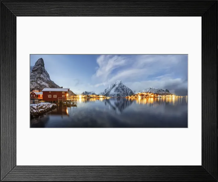 Framed Print : Olstind mount and traditional red fishermens cabins mirrored in the cold sea at dusk Framed Print : Olstind mount and traditional red fishermens cabins mirrored in the cold sea at dusk