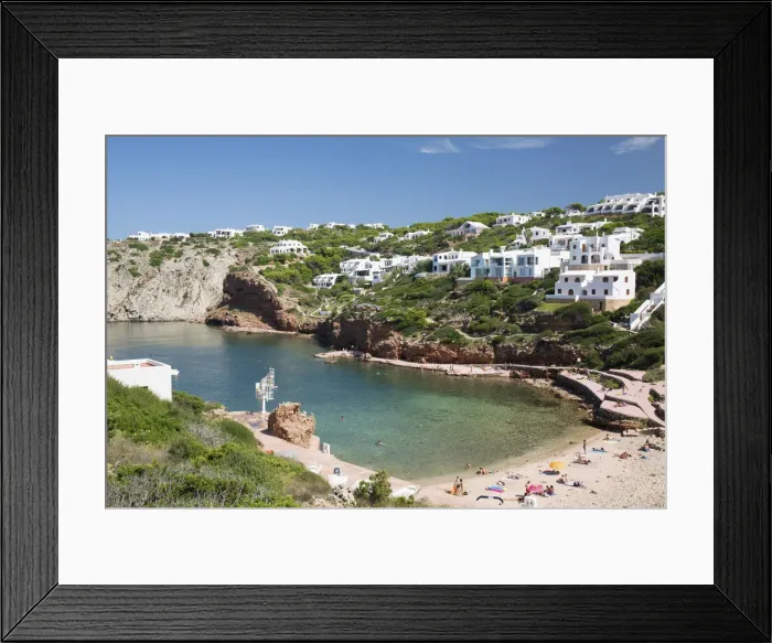 Framed Print : View over sandy beach to residential hillside above bay of clear turquoise water Framed Print : View over sandy beach to residential hillside above bay of clear turquoise water