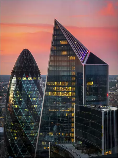 The Gherkin and Scalpel buildings in the City of London at dusk, London, England