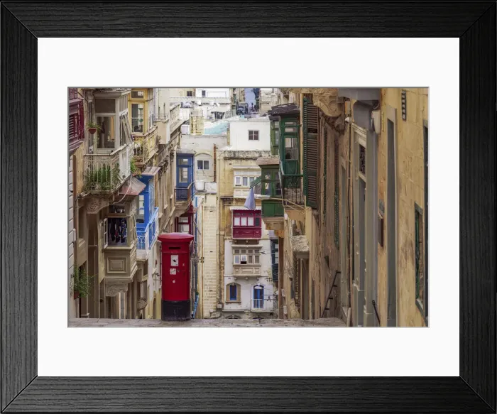 Framed Print : Typical street scene of alley with traditional homes, colorful balconies and red post box, Valletta, Malta, Europe Framed Print : Typical street scene of alley with traditional homes, colorful balconies and red post box, Valletta, Malta, Europe