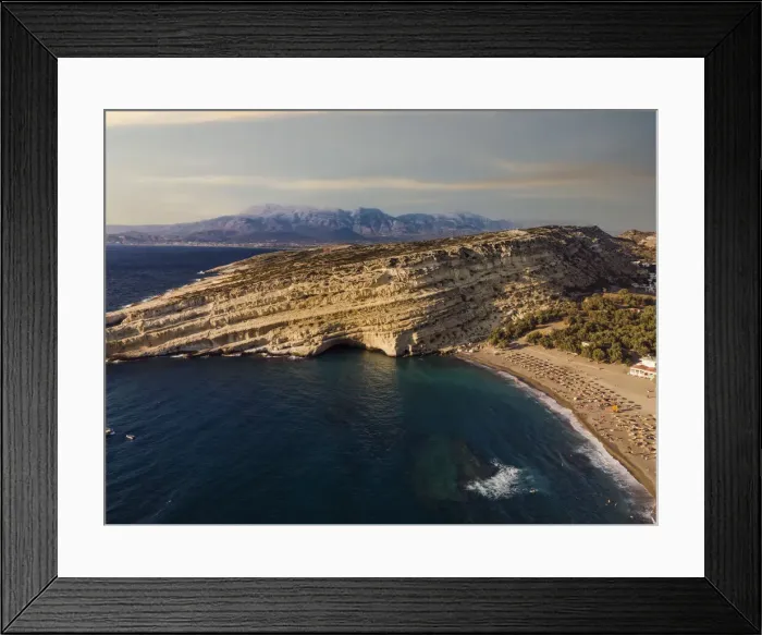 Framed Print : Drone view of Matala artificial caves on the rock by the beach at Crete, Greek Islands, Greece, Europe Framed Print : Drone view of Matala artificial caves on the rock by the beach at Crete, Greek Islands, Greece, Europe
