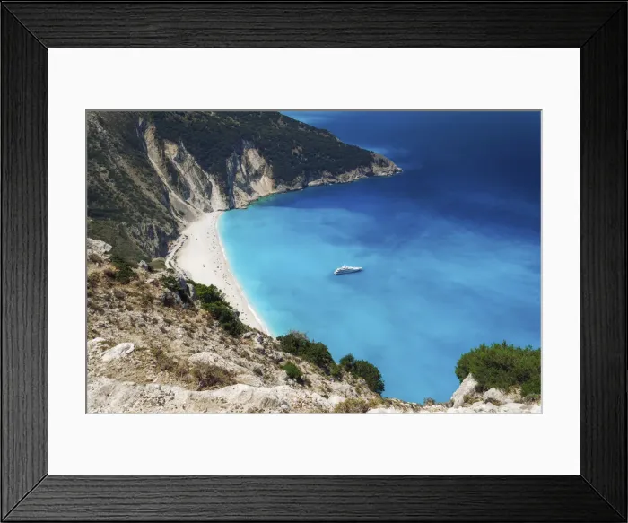 Framed Print : Panoramic view of world famous Myrtos beach with crystal clear waters and moored yacht in Kefalonia island, Greek Islands, Greece, Europe Framed Print : Panoramic view of world famous Myrtos beach with crystal clear waters and moored yacht in Kefalonia island, Greek Islands, Greece, Europe