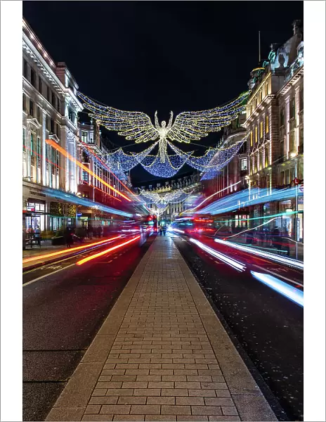 Christmas decorations in Regent Street with light trails, London, England, United Kingdom, Europe