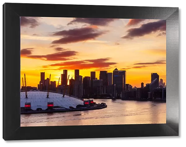 Sunset behind Canary Wharf, Docklands, and O2 Arena, London, England, United Kingdom, Europe