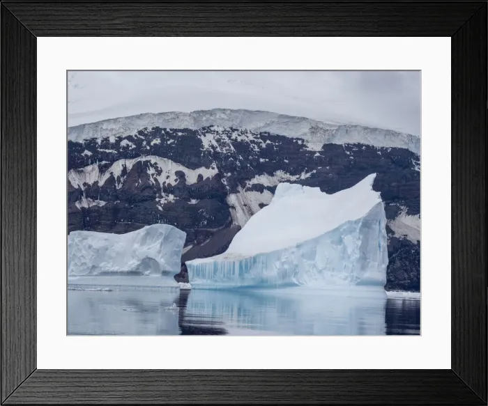 Framed Print : Icebergs surround the glacier covered volcano called Peter I Island in the Bellingshausen Sea, Antarctica, Polar Regions Framed Print : Icebergs surround the glacier covered volcano called Peter I Island in the Bellingshausen Sea, Antarctica, Polar Regions