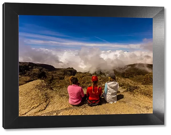 Women taking in the view on their way up Mount Kilimanjaro, UNESCO World Heritage Site, Tanzania, East Africa, Africa