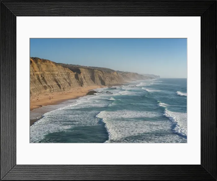 Framed Print : Magoito beach with surfers surfing on the sea waves, near Sintra, Portugal, Europe Framed Print : Magoito beach with surfers surfing on the sea waves, near Sintra, Portugal, Europe