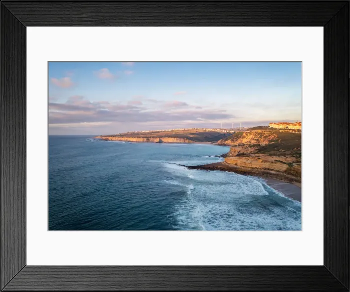Framed Print : Ericeira drone aerial view on the coast of Portugal with surfers on the sea at sunset, Lisbon area, Portugal, Europe Framed Print : Ericeira drone aerial view on the coast of Portugal with surfers on the sea at sunset, Lisbon area, Portugal, Europe