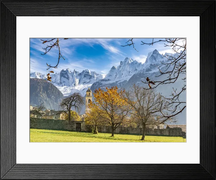 Framed Print : Old church lit by autumn colors with snowcapped Piz Badile and Cengalo in the background, Soglio, Graubunden, Switzerland, Europe Framed Print : Old church lit by autumn colors with snowcapped Piz Badile and Cengalo in the background, Soglio, Graubunden, Switzerland, Europe
