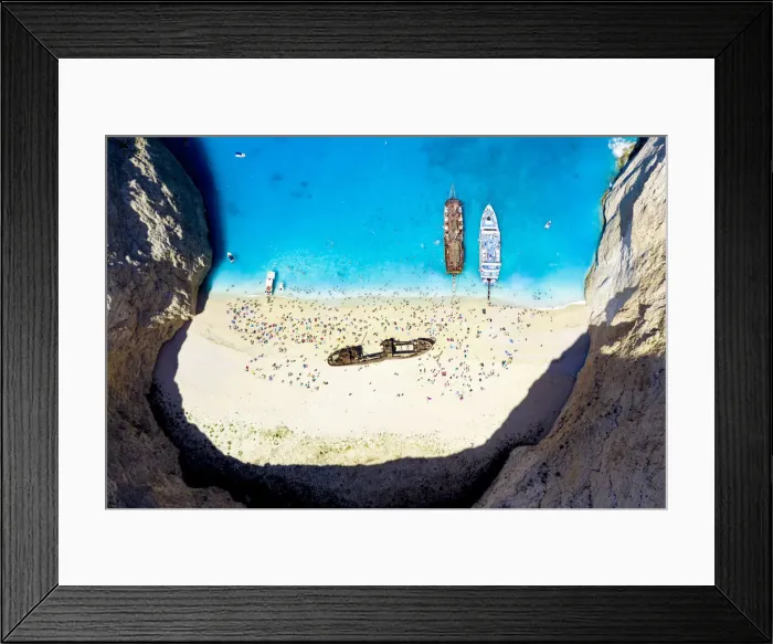 Framed Print : Crowd of tourists sunbathing on the idyllic Shipwreck Beach (Navagio Beach), aerial view, Zakynthos island, Greek Islands, Greece, Europe Framed Print : Crowd of tourists sunbathing on the idyllic Shipwreck Beach (Navagio Beach), aerial view, Zakynthos island, Greek Islands, Greece, Europe