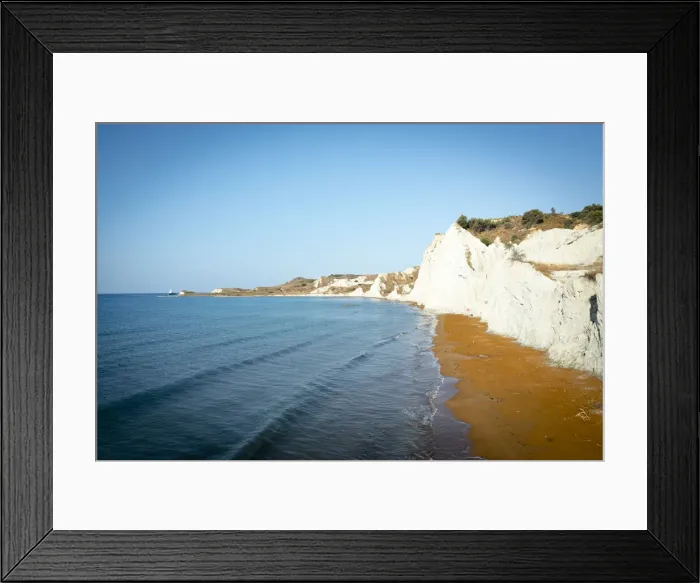 Framed Print : Sunrise over the gold sand of Xi beach surrounded by majestic limestone cliffs, Kefalonia, Ionian Islands, Greek Islands, Greece, Europe