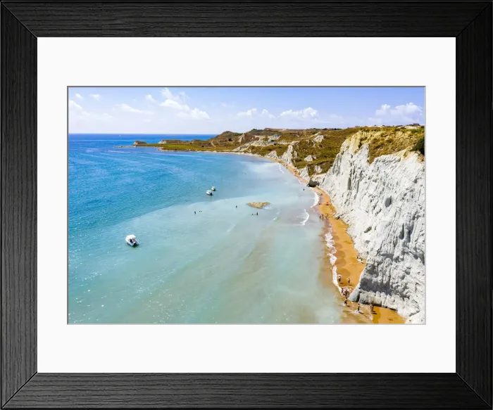 Framed Print : Aerial view of majestic limestone cliffs framing the golden sand of Xi beach, Kefalonia, Ionian Islands, Greek Islands, Greece, Europe Framed Print : Aerial view of majestic limestone cliffs framing the golden sand of Xi beach, Kefalonia, Ionian Islands, Greek Islands, Greece, Europe