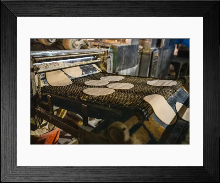 Framed Print : Fresh Roti being made on a conveyor belt at the Golden Temple, Amritsar, Punjab, India, Asia Framed Print : Fresh Roti being made on a conveyor belt at the Golden Temple, Amritsar, Punjab, India, Asia