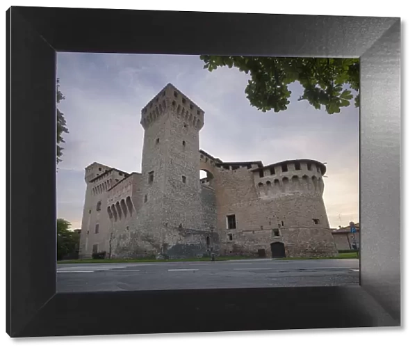 Medieval castle of Vignola with fortified tower, framed by tree branches, Vignola, Emilia Romagna, Italy, Europe
