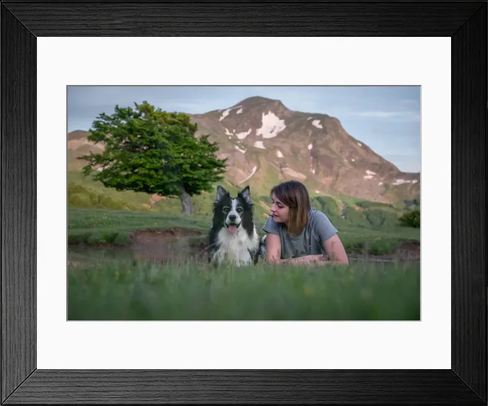 Framed Print : A girl and her border collie dog lying in the grass with a tree and mountain in the background, Emilia Romagna, Italy, Europe Framed Print : A girl and her border collie dog lying in the grass with a tree and mountain in the background, Emilia Romagna, Italy, Europe