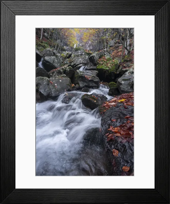 Framed Print : Long exposure of a waterfall flowing between rocks in a wood during autumn, Emilia Romagna, Italy, Europe Framed Print : Long exposure of a waterfall flowing between rocks in a wood during autumn, Emilia Romagna, Italy, Europe