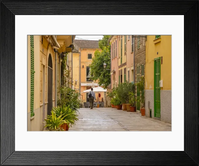 Framed Print : Woman walking down narrow street in the old town of Alcudia, Alcudia, Majorca, Balearic Islands, Spain, Mediterranean, Europe Framed Print : Woman walking down narrow street in the old town of Alcudia, Alcudia, Majorca, Balearic Islands, Spain, Mediterranean, Europe