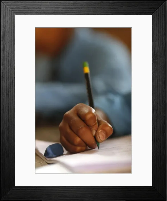 Framed Print : Primary school, boy in classroom, close-up on pencil, concept of education and school life, Kathmandu, Nepal, Asia Framed Print : Primary school, boy in classroom, close-up on pencil, concept of education and school life, Kathmandu, Nepal, Asia