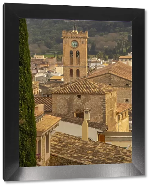 View of church clock tower and rooftops in the old town of Pollenca, Pollenca, Majorca, Balearic Islands, Spain, Mediterranean, Europe