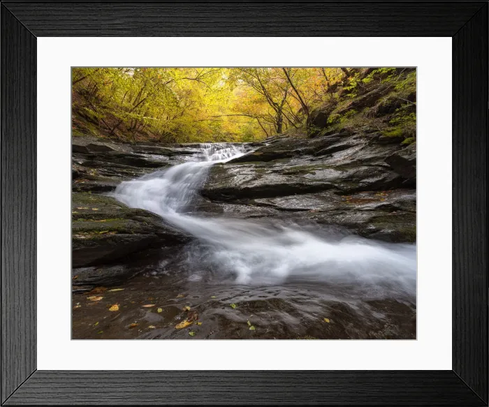 Framed Print : Autumn Colors in a beech trees wood with a waterfall flowing between rocks, long exposure, Emilia Romagna, Italy Framed Print : Autumn Colors in a beech trees wood with a waterfall flowing between rocks, long exposure, Emilia Romagna, Italy