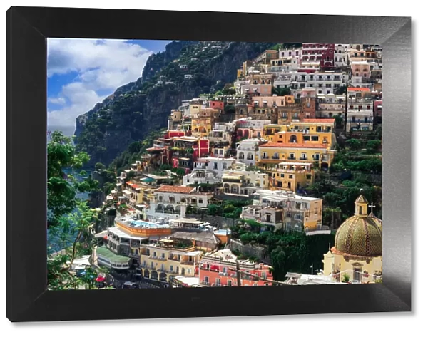 Positano town hill view with low rise colorful buildings above the sea line, Positano, Amalfi Coast, UNESCO World Heritage Site, Campania, Italy, Europe