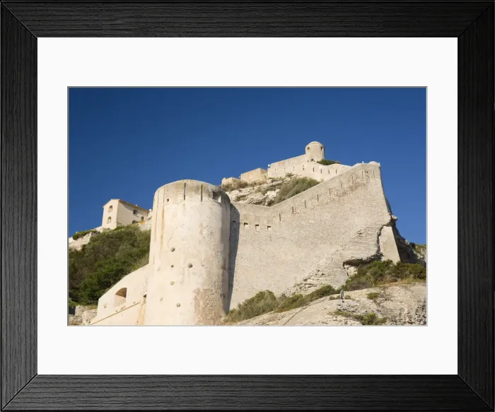 Framed Print : Low angle view of the massive stone walls and defensive towers of the citadel, Bonifacio, Corse-du-Sud, Corsica, France, Mediterranean, Europe Framed Print : Low angle view of the massive stone walls and defensive towers of the citadel, Bonifacio, Corse-du-Sud, Corsica, France, Mediterranean, Europe