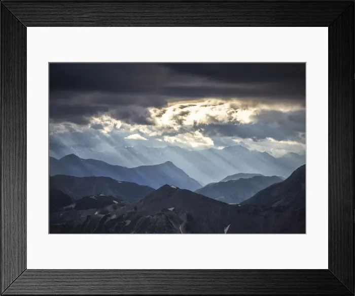 Framed Print : Sun rays filter between black clouds at sunset, Stelvio Mountain pass, Stelvio National Park, Valtellina, Lombardy, Italy, Europe Framed Print : Sun rays filter between black clouds at sunset, Stelvio Mountain pass, Stelvio National Park, Valtellina, Lombardy, Italy, Europe