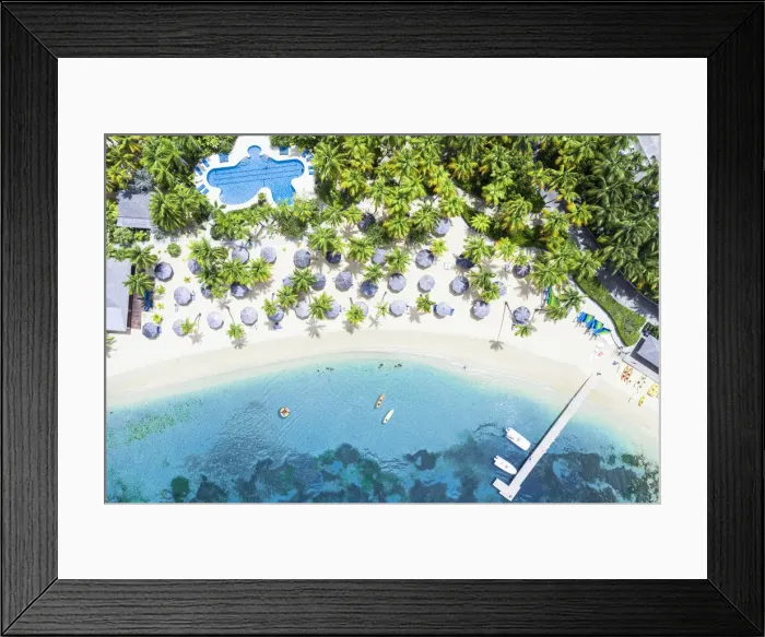 Framed Print : Canoes floating in the tropical lagoon of luxury resort with swimming pool on palm fringed beach, Antigua, West Indies, Caribbean, Central America Framed Print : Canoes floating in the tropical lagoon of luxury resort with swimming pool on palm fringed beach, Antigua, West Indies, Caribbean, Central America