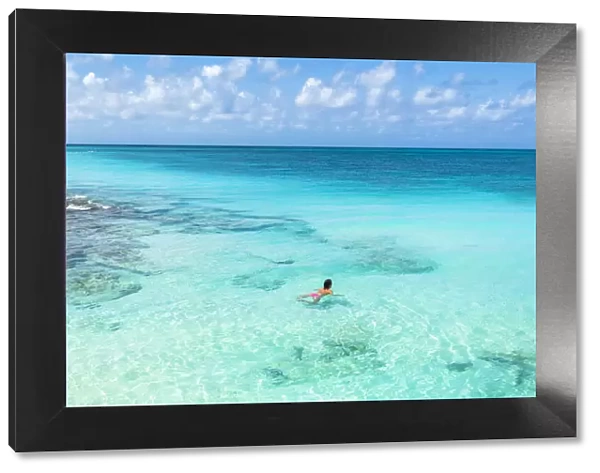 Beautiful woman enjoying swimming in the crystal Caribbean Sea, Antigua, Antigua and Barbuda, Leeward Islands, West Indies, Caribbean, Central America