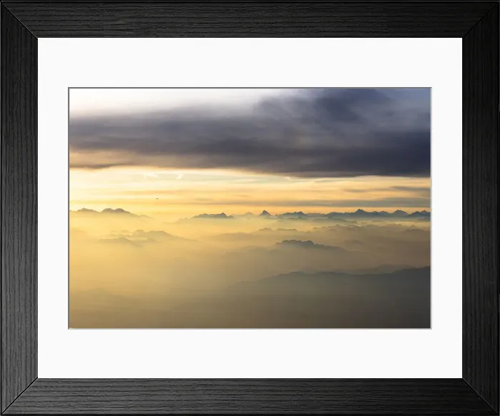 Framed Print : Flying over the majestic Swiss Alps in a sea of clouds at sunset, Switzerland, Europe Framed Print : Flying over the majestic Swiss Alps in a sea of clouds at sunset, Switzerland, Europe