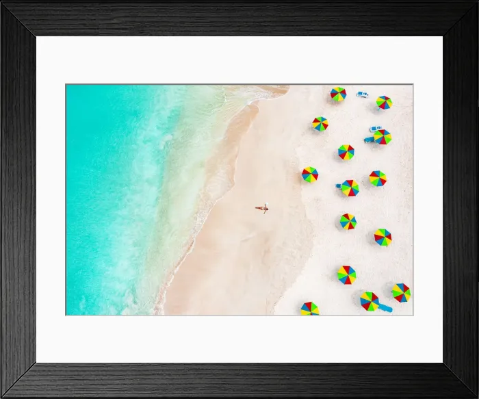 Framed Print : Aerial view of woman in bikini sunbathing on a tropical beach next to colorful umbrellas, Antigua, West Indies, Caribbean, Central America Framed Print : Aerial view of woman in bikini sunbathing on a tropical beach next to colorful umbrellas, Antigua, West Indies, Caribbean, Central America