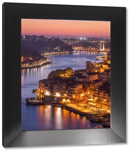 Skyline of the historic city of Porto at sunset with the bridge Ponte de Arrabida in the background, Portugal, Europe