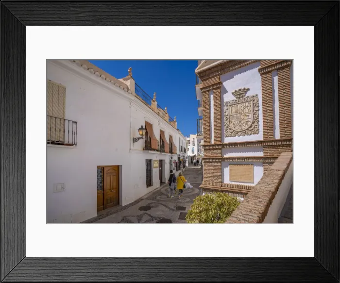 Framed Print : View of whitewashed houses and shoppers on narrow street, Frigiliana, Malaga Province, Andalucia, Spain, Mediterranean, Europe Framed Print : View of whitewashed houses and shoppers on narrow street, Frigiliana, Malaga Province, Andalucia, Spain, Mediterranean, Europe