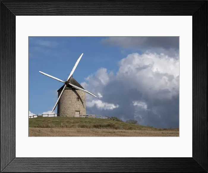 Framed Print : Windmill on top of a hill with a blue sky with white clouds, Normandy, France, Europe Framed Print : Windmill on top of a hill with a blue sky with white clouds, Normandy, France, Europe