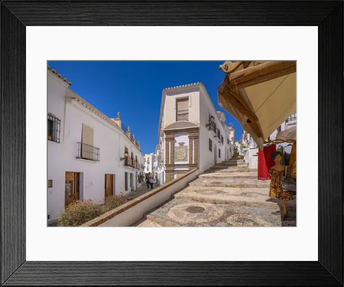 Framed Print : View of whitewashed houses and clothes shop on narrow street, Frigiliana, Malaga Province, Andalucia, Spain, Mediterranean, Europe Framed Print : View of whitewashed houses and clothes shop on narrow street, Frigiliana, Malaga Province, Andalucia, Spain, Mediterranean, Europe