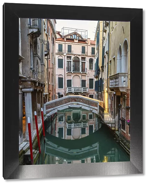 Reflections of houses and bridge in the canal, Sestiere San Marco, Venice, UNESCO World Heritage Site, Veneto, Italy, Europe